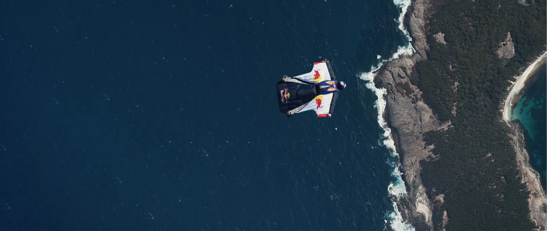 Red Bull wingsuit athlete above the coastline, from the ADD brand portfolio